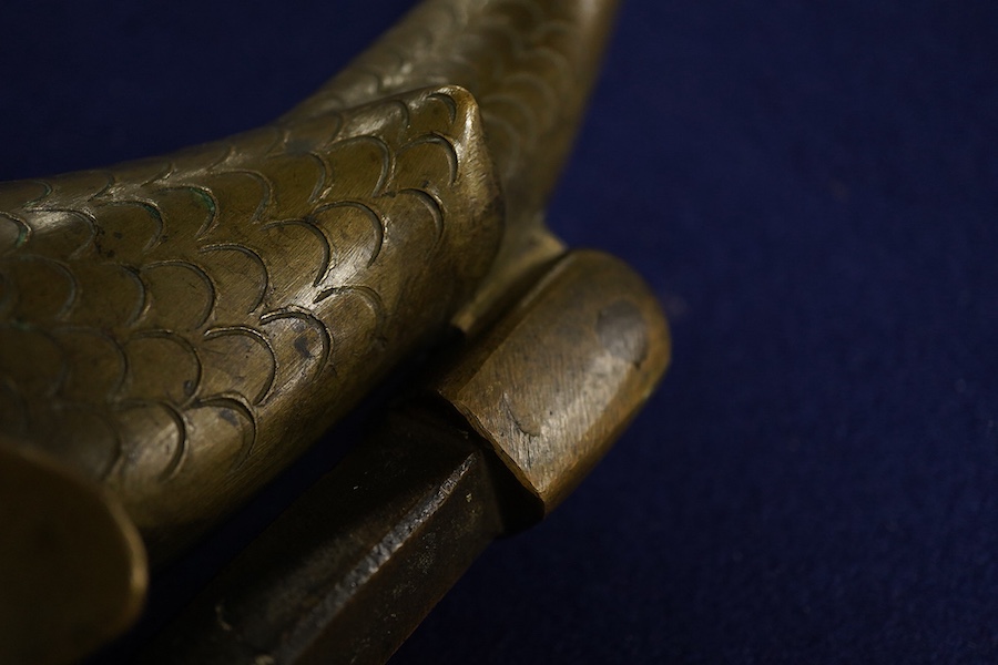 An early 20th century bronze ‘dolphin’ door knocker, 20cm